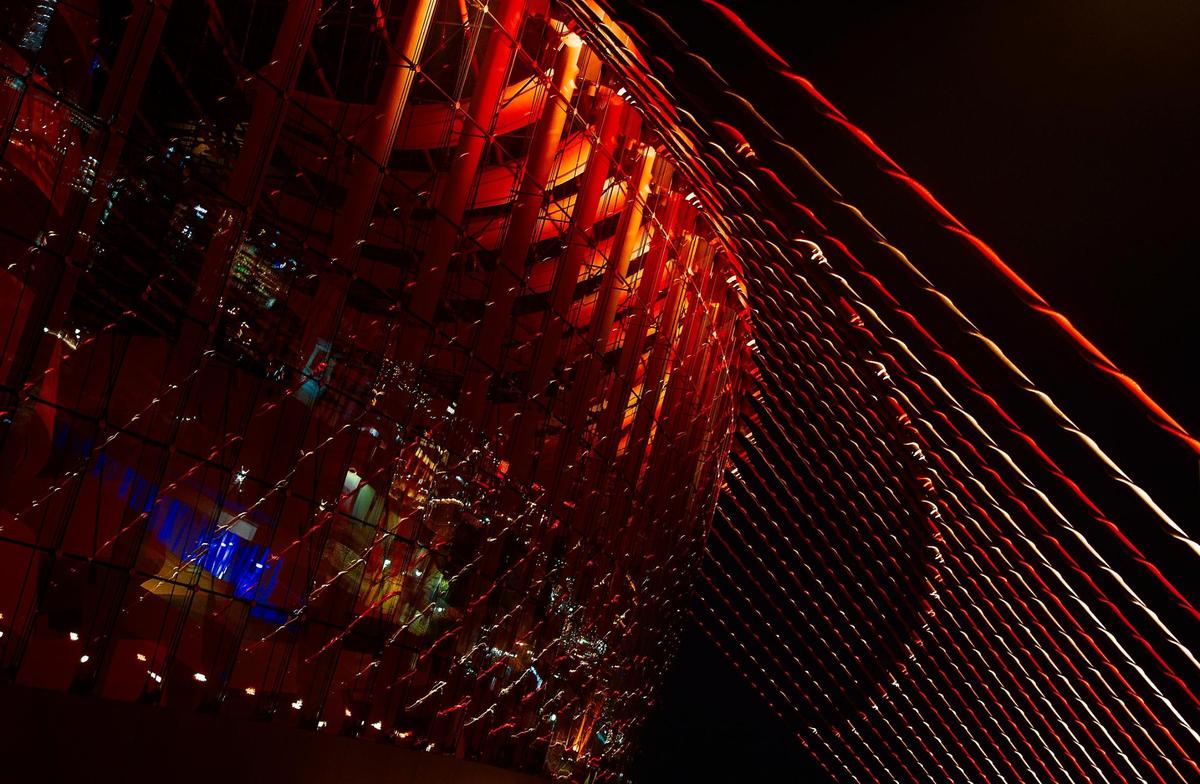 The stay cables and glass facade are lit in red and gold to celebrate the Kansas City ChiefsÕ trip to Super Bowl LV.