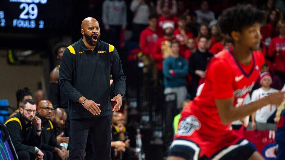 Missouri head coach Cuonzo Martin, front left, yells from the sideline during an NCAA college basketball game against Liberty in Lynchburg, Va., Thursday, Dec. 2, 2021. (Kendall Warner/The News & Advance via AP)