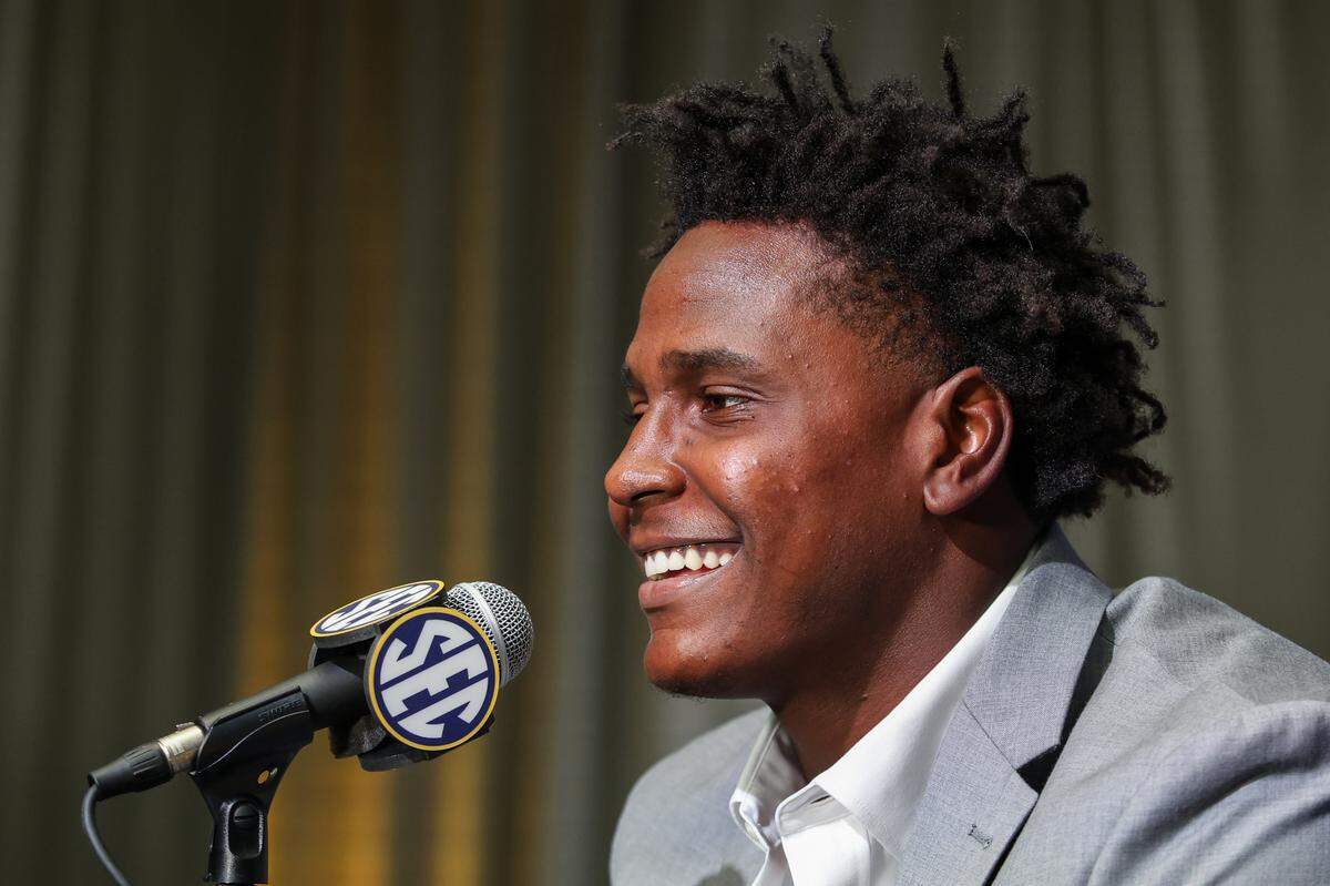 Missouri Tigers defensive end Zion Young smiles while fielding questions during SEC Media Days at the Omni Atlanta Hotel in Atlanta on Thursday, July 17, 2025.