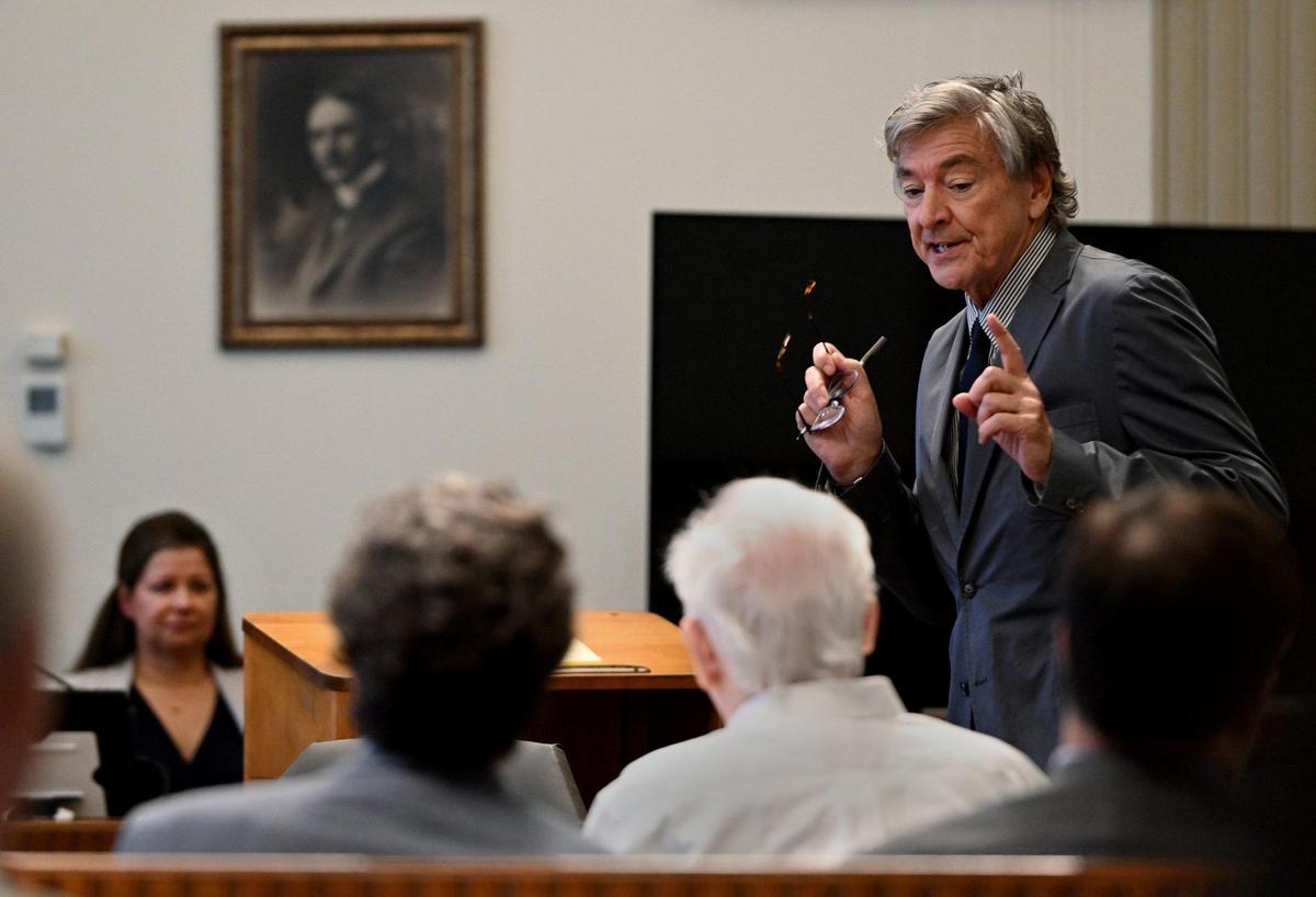 Defense attorney Daniel Ross, right, tried Tuesday to convince a judge that his client, David G. Jungerman, in white shirt, was not mentally competent to stand trial for the murder of Kansas City attorney Tom Pickert in 2017.