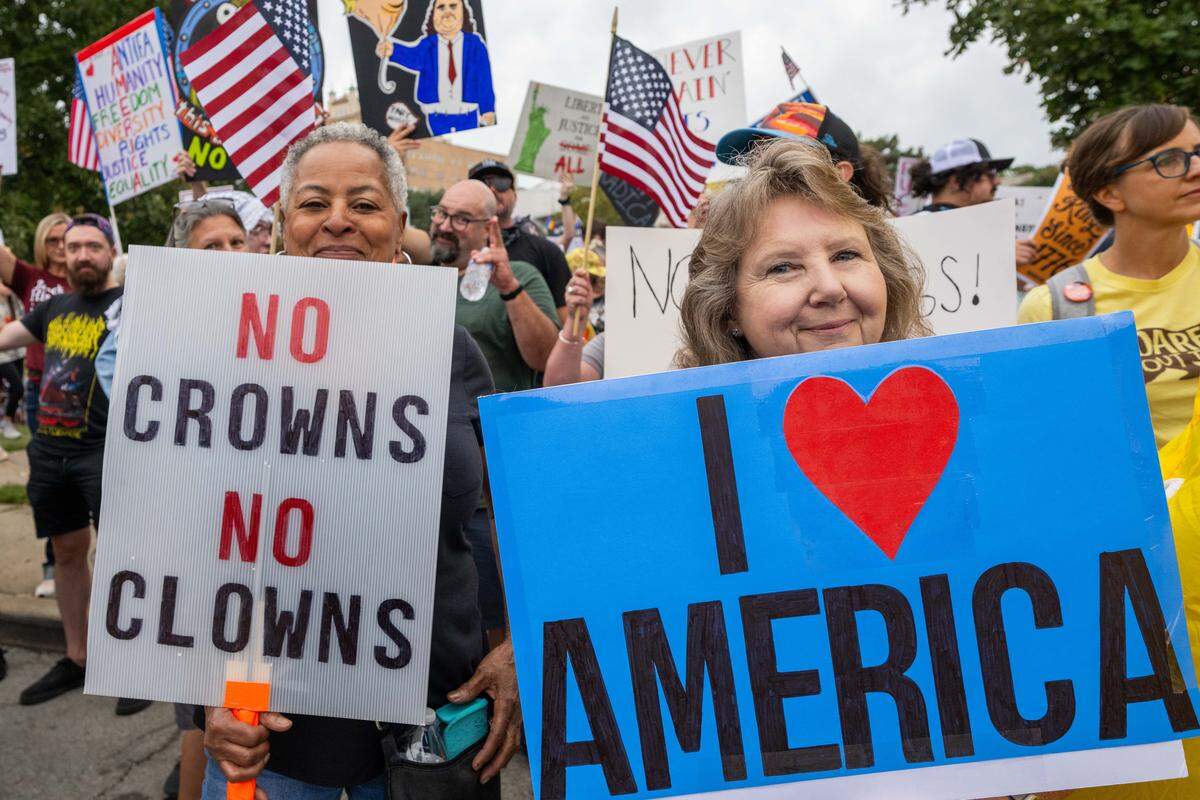 Janielle Ferguson and Cheryl Scofield of Blue Springs attend the “No Kings” protests against the Trump administration on Saturday, October 18, 2025, at Mill Street Park in Kansas City.