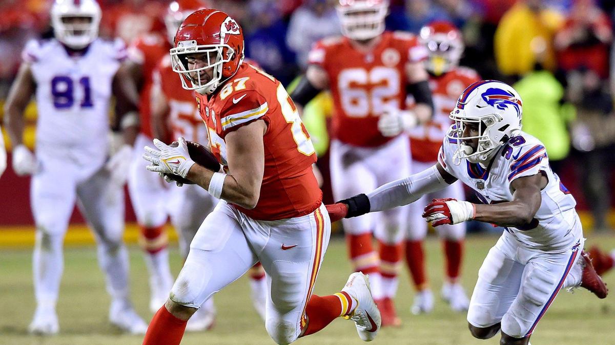 Kansas City Chiefs tight end Travis Kelce makes a first down play as Buffalo Bills cornerback Levi Wallace defends in overtime of the AFC Divisional Playoff game between the Kansas City Chiefs and the Buffalo Bills at GEHA Field at Arrowhead Stadium Sunday, Dec. 23, 2022. The Chiefs defeated the Bills in overtime, 42-36. Kelce later made the winning touchdown catch.