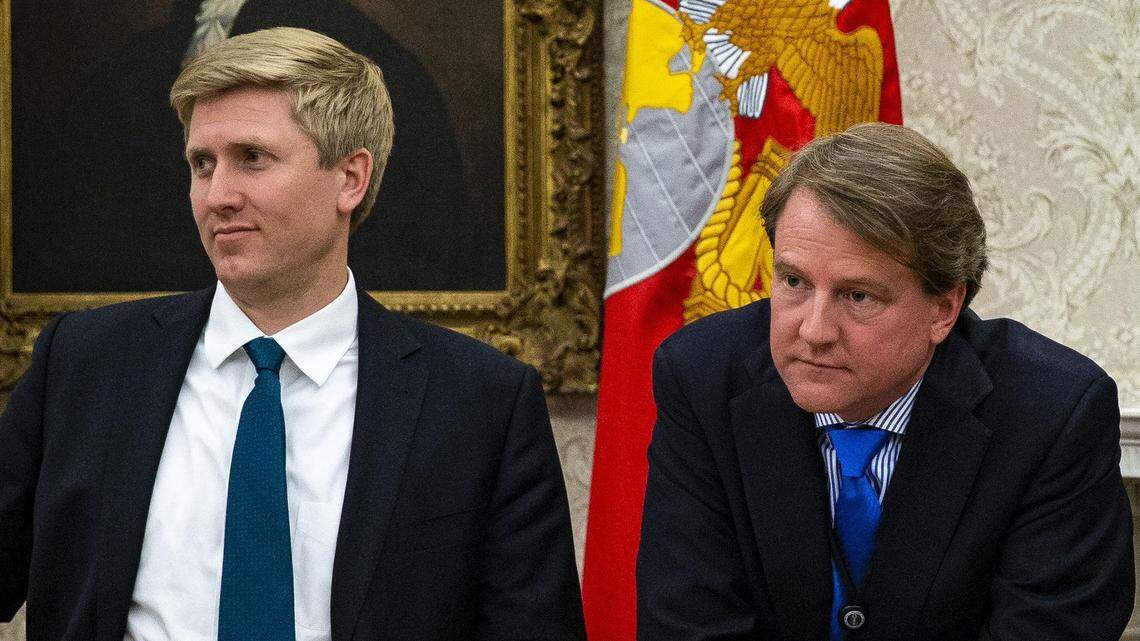 Nick Ayers (left), Vice President Mike Pence’s chief of staff, and Don McGahn, the White House counsel, watch as President Donald Trump speaks after signing an executive order on immigrant family separations on June 20.