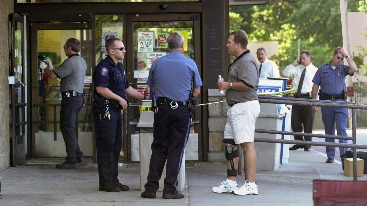 Johnson County Sheriff’s Department deputies and investigators along with a Roeland Park Police officer and a Westwood Police officer were among the law enforcement personnel at the scene of Westwood’s first murder early Aug. 15, 2003, at the former Apple Market at 47th Avenue and Mission Road.