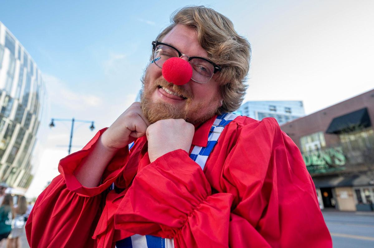Josh Cashion of St. Louis wears a smile-themed clown costume while standing in line for Katy Perry’s Lifetimes Tour at the T-Mobile Center on Saturday, May 10, in Kansas City.