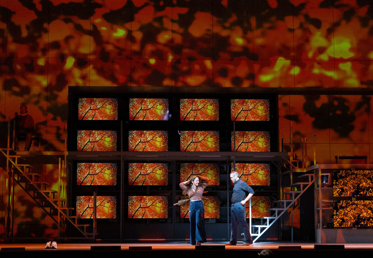 “The set can transform from an apple orchard to the Apple corporate headquarters,” says composer Mason Bates. In this scene, Steve Jobs is with his former romantic partner, Chrisann Brennan.