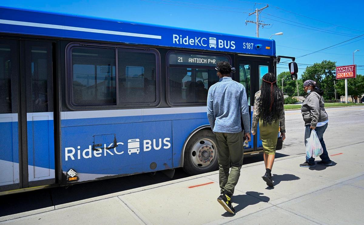 Lekatta English, right, and her children, Maraih Brand, center, and Malachi Brand, left, board a RideKC Bus on Thursday, June 2, outside the Transit Center at 7501 Prospect Ave. English said there are fewer bus routes on Sundays, which has made it more difficult to get around the city.