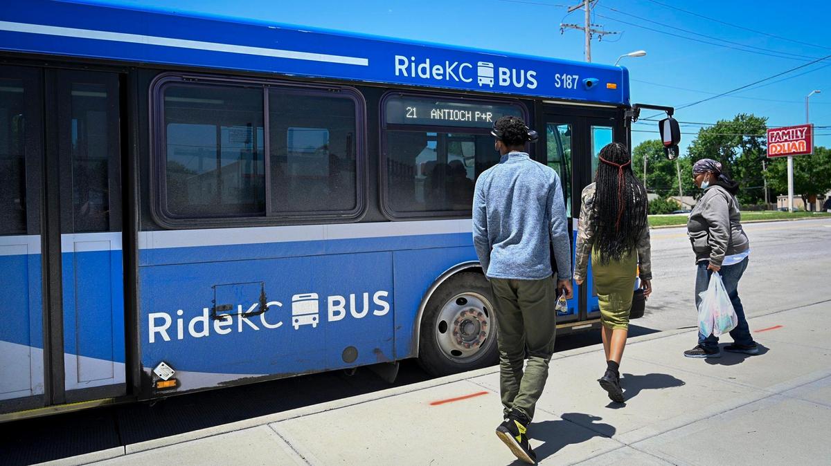 Passengers board a KCATA RideKC Bus outside the Transit Center, 7501 Prospect Ave., in Kansas City. 