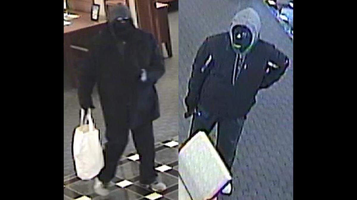 The FBI released surveillance images of two men accused of robbing Equity Bank, 6200 Northwest 63rd Terrace in Kansas City, at gunpoint and restraining employees in the process around 10:56 a.m. Feb. 15. Suspect No. 1 is pictured on the left and suspect No. 2 is pictured on the right.