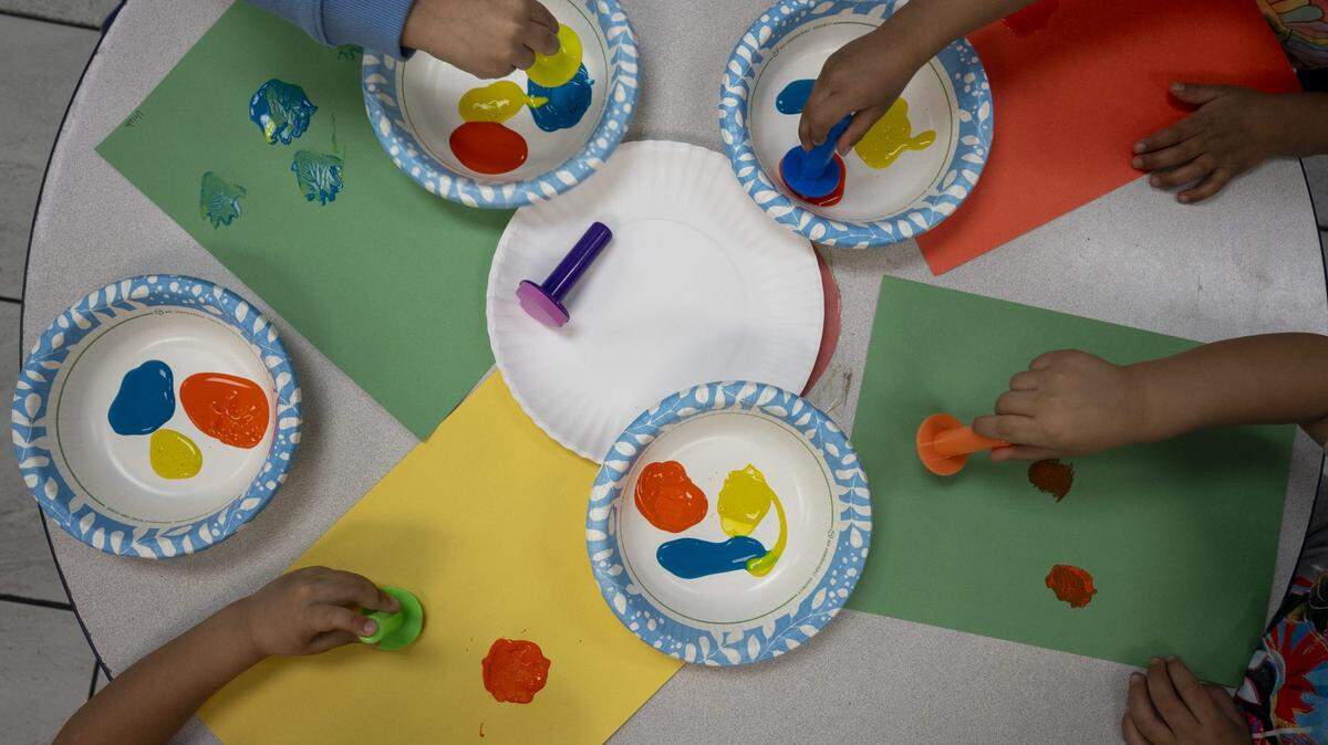 3-year-old students paint in their classroom in February. At least four early childhood programs in KC could be at risk.
