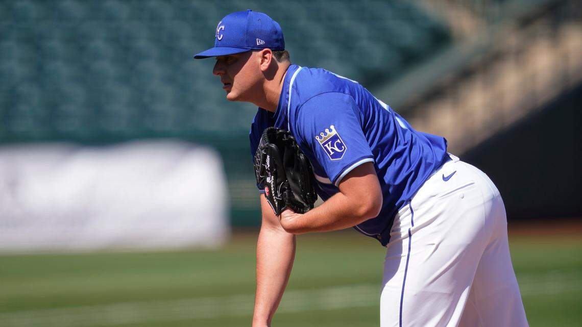 Kansas City Royals’ Brad Keller looks in for the sign during a spring training baseball game against the Los Angeles Dodgers, Friday, March 5, 2021, in Surprise, Ariz.