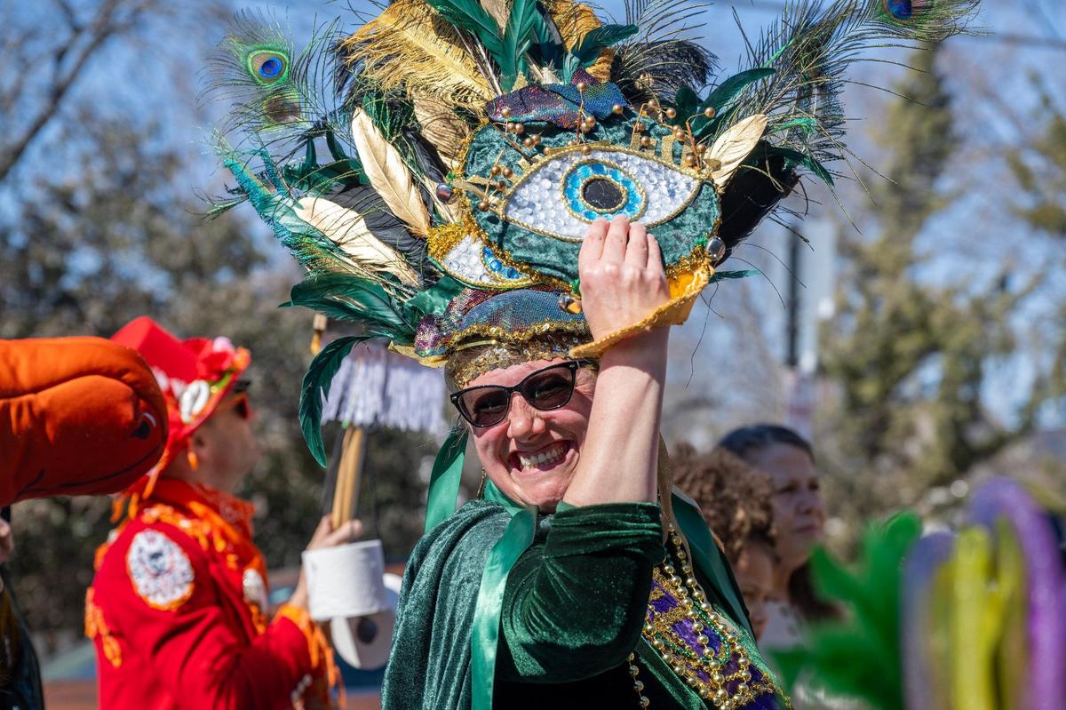Tessa Sullivan smiles as she participates in the Krewe de Prank parade on Sunday, March 2, 2025, in Kansas City.