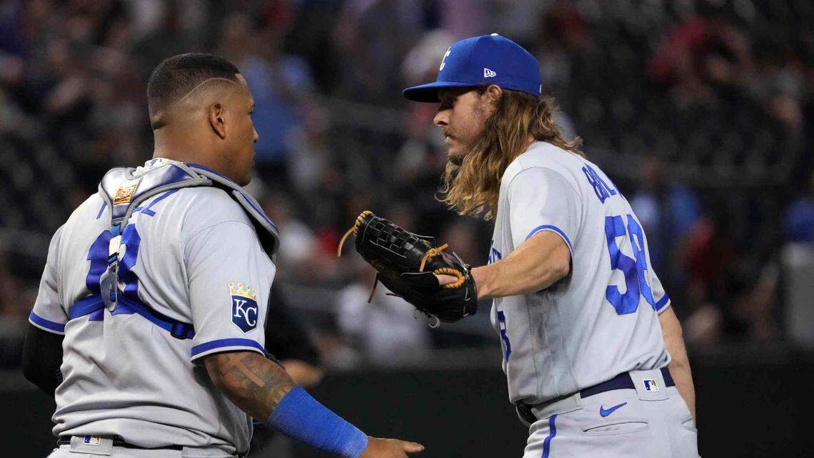 Kansas City Royals catcher Salvador Perez (13) and closer Scott Barlow (58) celebrate after defeating the Arizona Diamondbacks at Chase Field on April 25, 2023.