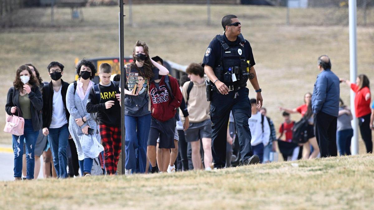 Olathe East High School students being led to reunite with their parents after a March 4 shooting at their school.