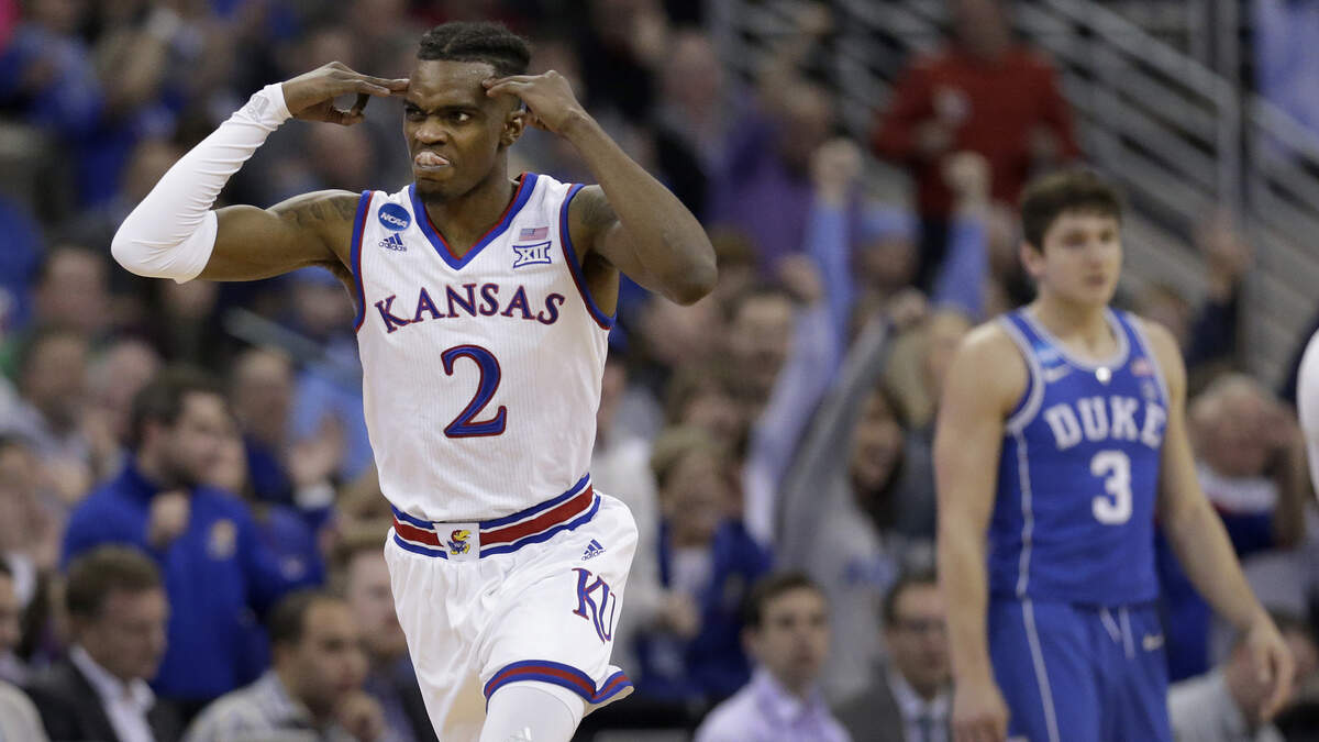 KU's Lagerald Vick (left) celebrated after making a three-point basket against Duke in the 2018 NCAA Tournament.