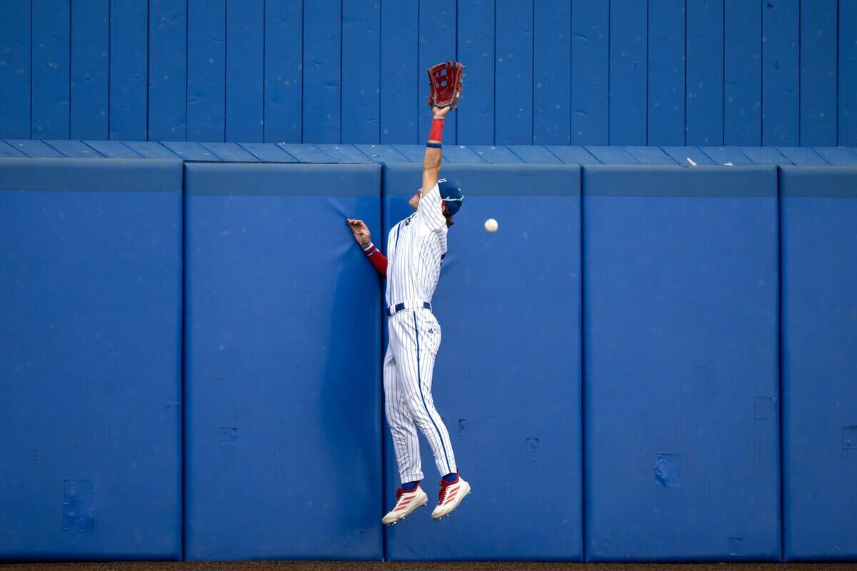 Kansas utility player Tyson Owens (5) misses a fly ball in the fifth inning during an NCAA Tournament baseball game against Oklahoma at Hoglund Ballpark on Saturday, June 6, 2026, in Lawrence.