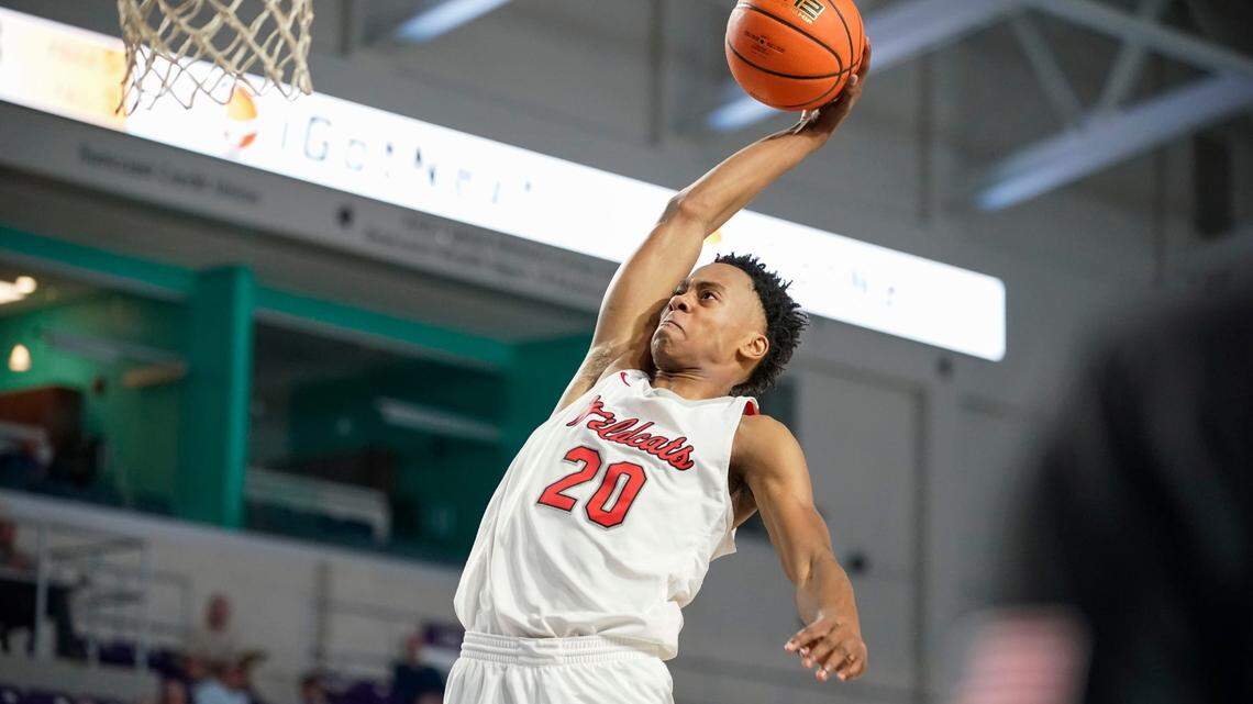 Lake Highlands guard Tre Johnson (20) goes up for a dunk against the Newton Rams during the City of Palms Classic at Suncoast Arena in Ft. Myers on Friday, Dec. 16, 2022.