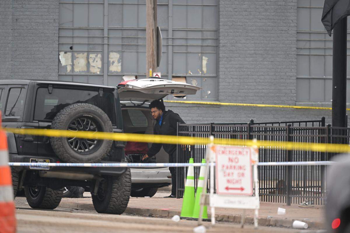 An employee with the Jackson County Medical Examiner’s office removes the body of one of two people killed in a shooting at a nightclub near 28th Street and Southwest Boulevard in Kansas City’s Westside early Sunday, Feb. 15. Two others were injured in the shooting, including one seriously.