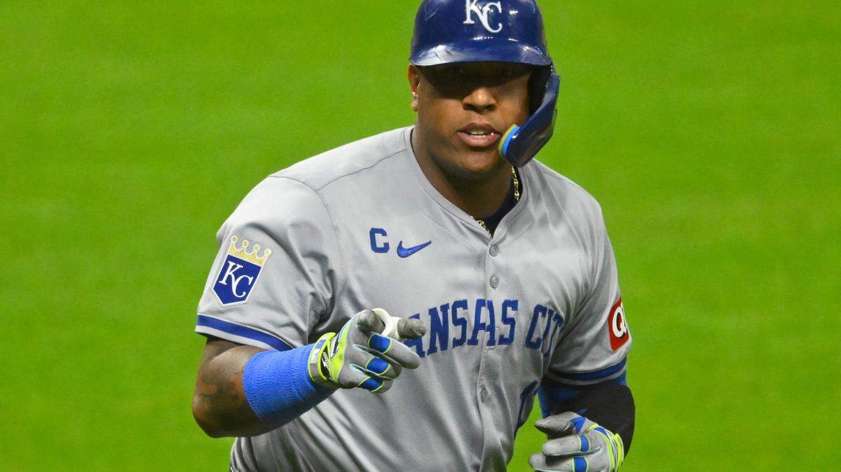 Aug 26, 2024; Cleveland, Ohio, USA; Kansas City Royals designated hitter Salvador Perez (13) points to his dugout after hitting a grand slam in the sixth inning against the Cleveland Guardians at Progressive Field.