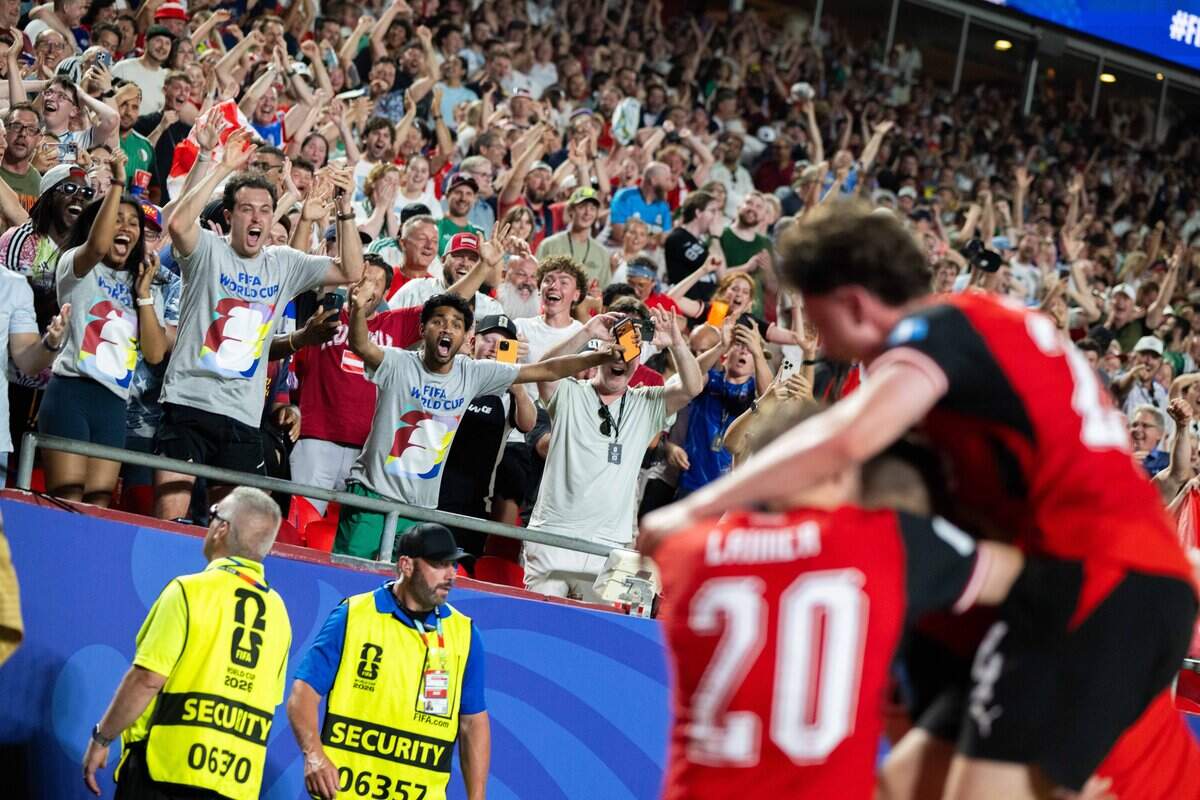 Fans celebrate after a last minute goal by Austria in a FIFA World Cup group-stage soccer match at Kansas City (Arrowhead) Stadium in Kansas City on Saturday, June 27, 2026.
