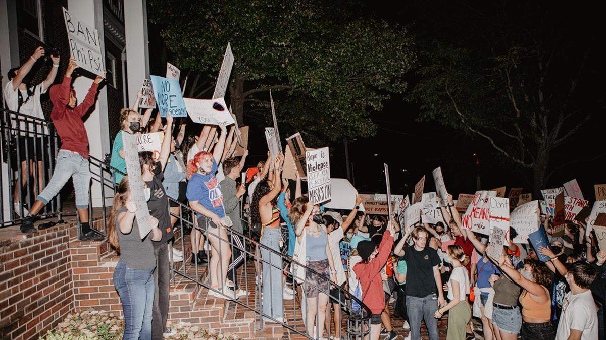 Protesters gathered at the Phi Kappa Psi fraternity house off of the University of Kansas campus in Lawrence in September 2021 after a sex crime was reported there.