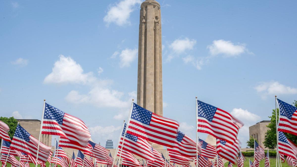 140 U.S flags are displayed in front of the Liberty Memorial Tower, each representing a veteran lost to suicide in one week, at the National WWI Museum and Memorial on Friday, May 24, 2024, in Kansas City.
