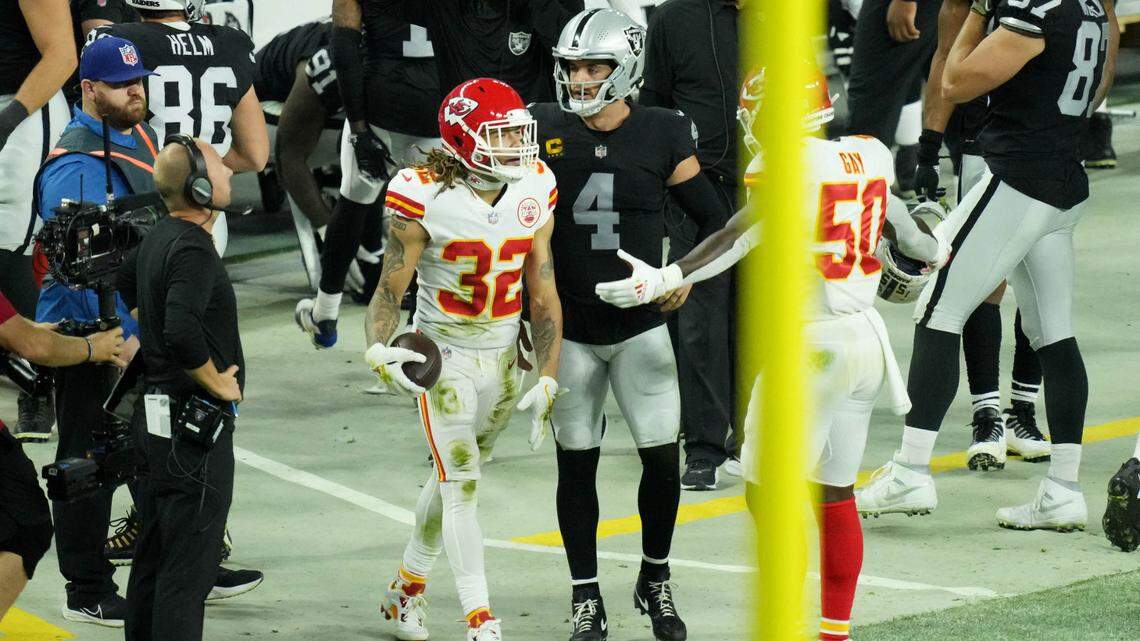 Kansas City Chiefs free safety Tyrann Mathieu (32) reacts with middle linebacker Willie Gay Jr. (50) and Las Vegas Raiders quarterback Derek Carr (4) after forcing a fumble during a game in 2021. All three players are now with the Saints.