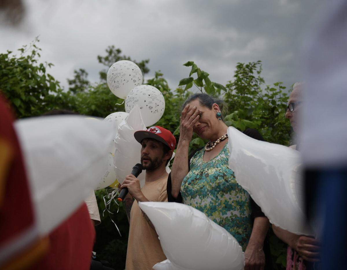 Randall Lammers, the uncle of 6-month-old Kha’liya Bridgewater, speaks during a balloon release for the infant on June 2, 2023, as Kha’liya’s grandmother, Ruthann Hickman, grieves the baby’s death.