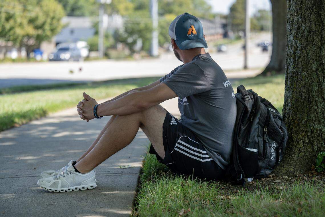 Brian, who has experienced homelessness, was photographed outside the Johnson County Library - Central Resource branch in Overland Park on Friday, September 26, 2025. He often waits for a bus along West 87th Street in front of the library. 