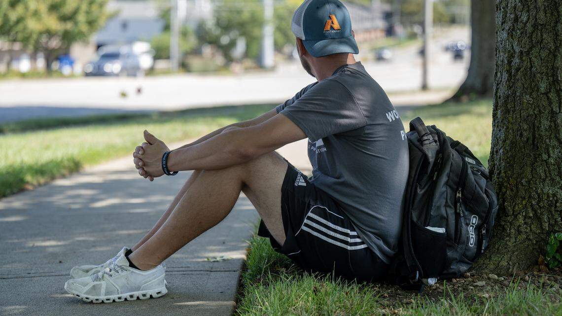 Brian, who has experienced homelessness, was photographed outside the Johnson County Library - Central Resource branch in Overland Park on Friday, September 26, 2025. He often waits for a bus along West 87th Street in front of the library.