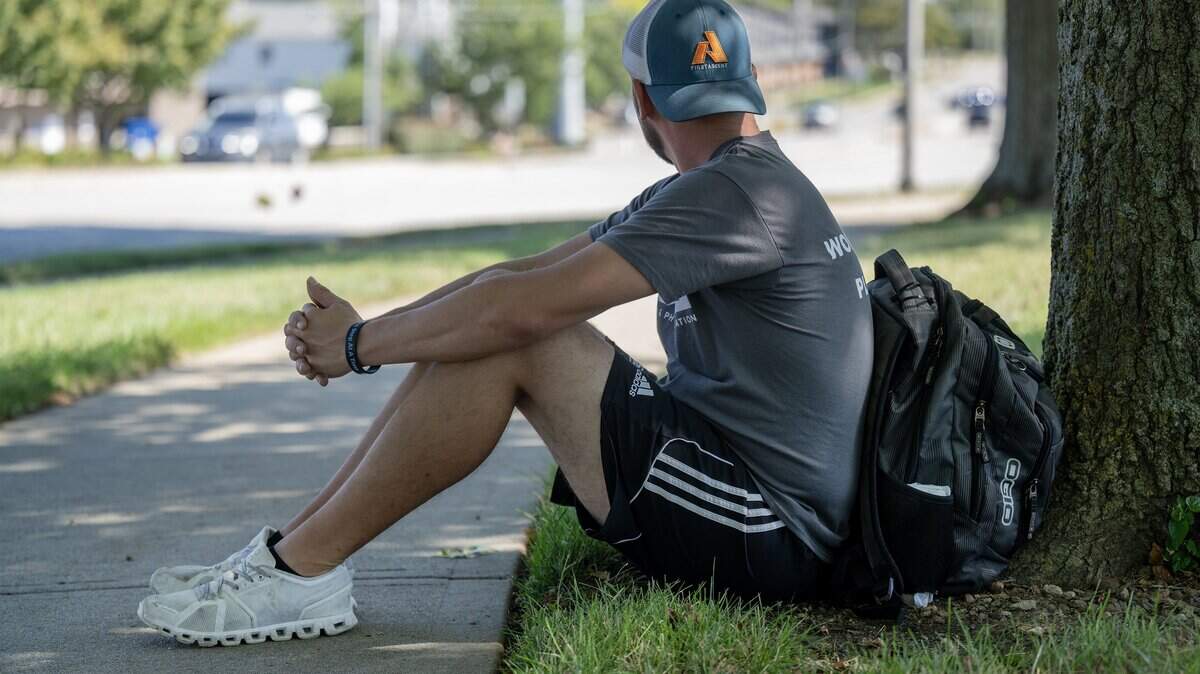 Brian, who has experienced homelessness, was photographed outside the Johnson County Library - Central Resource branch in Overland Park on Friday, September 26, 2025. He often waits for a bus along West 87th Street in front of the library.