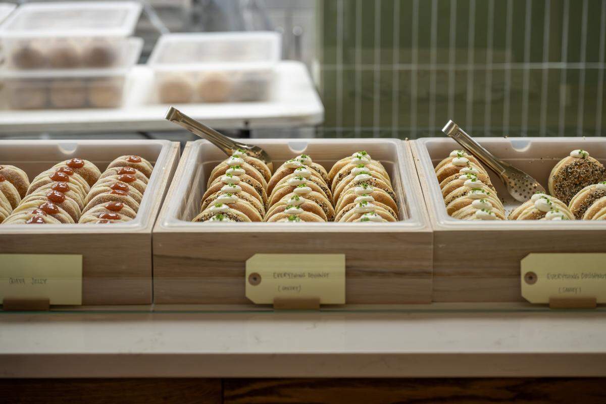 Doughnuts are displayed behind glass at Slow Rise on Friday, Jan. 23, 2026, in Overland Park.