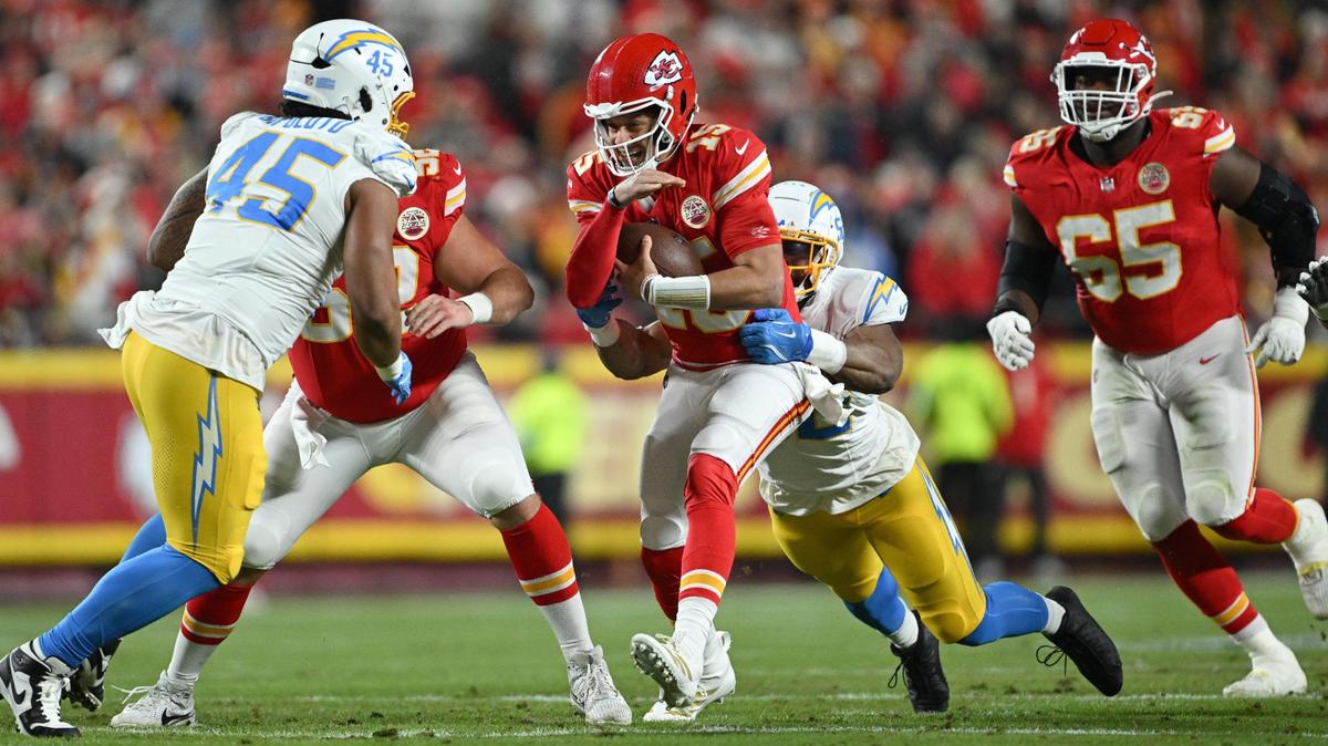 Kansas City Chiefs quarterback Patrick Mahomes (15) is tackled by Los Angeles Chargers linebacker Khalil Mack (52) in the first quarter on Sunday, Dec. 8, 2024, at GEHA Field at Arrowhead Stadium.