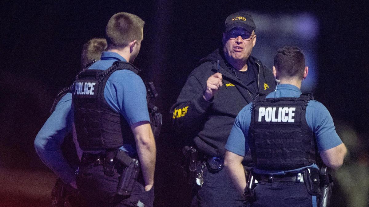 Kansas City police officers talked near the scene of a standoff in the 2300 block of Blue Ridge Boulevard earlier this year. The department is controlled by the state and the subject of a ballot initiative in August 2024.