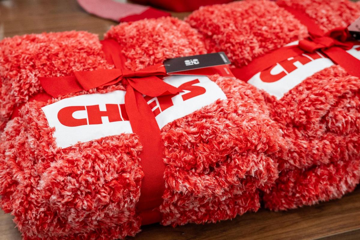 Red plush Kansas City Chiefs-themed blankets are displayed at the Chiefs Official Pro Shop at Arrowhead Stadium on Wednesday, Jan. 15, 2025, in Kansas City.