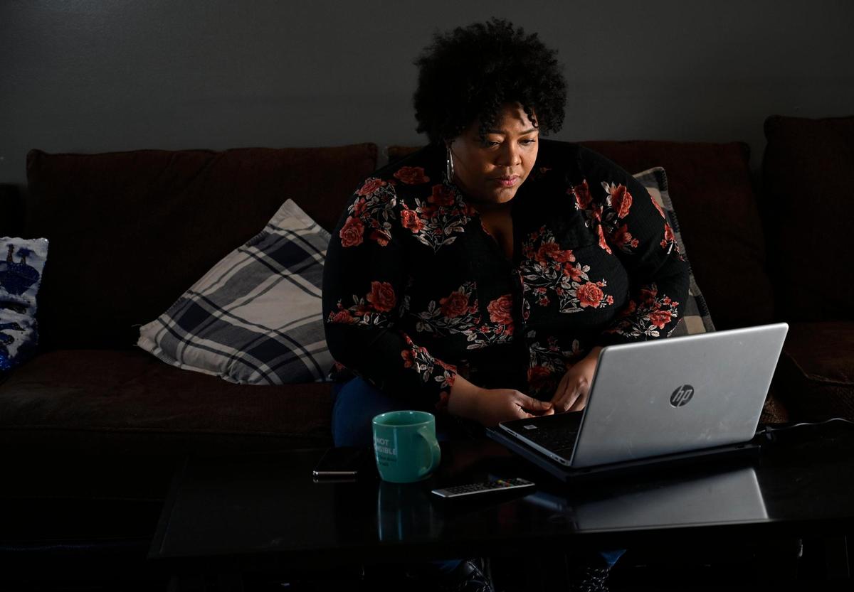 Davoya Marshall listens to the online meeting of We United on Saturday, Feb. 5, from her home in Lee’s Summit. We United is a non-partisan, nonprofit organization helping to advance all women’s economic and civic leadership.