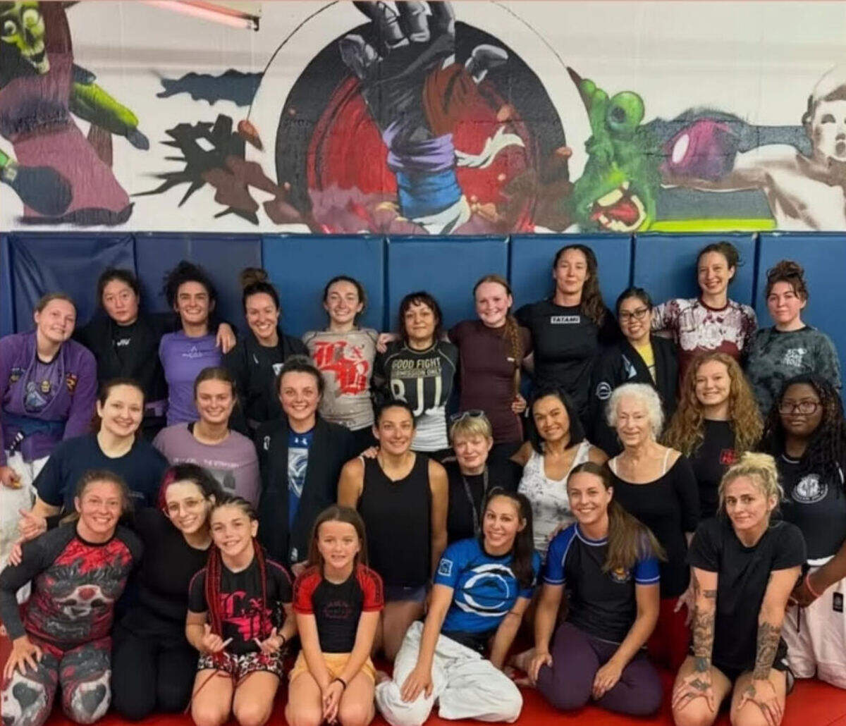 Attendees of the memorial open mat held in honor of Ray’Von Haney, pose for a photo on June 14, 2026.