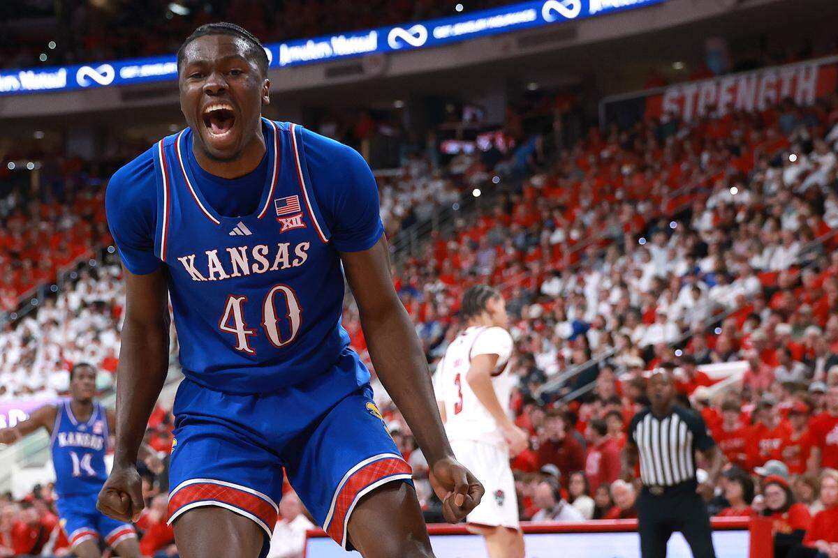 Flory Bidunga #40 of the Kansas Jayhawks reacts during the second half of the game against the NC State Wolfpack at Lenovo Center on December 13, 2025 in Raleigh, North Carolina.