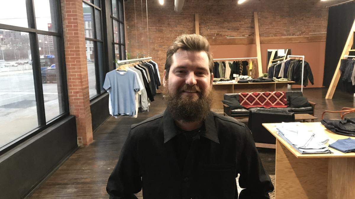 Cameron Niederhauser has opened East + West men's contemporary clothing store in the Crossroads.