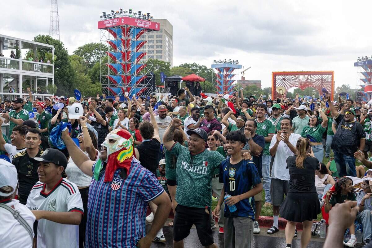 Mexico fans cheer after Mexico scores a goal during the first half of a FIFA World Cup match against South Africa while watching the match on a video screen at the FIFA Fan Festival on Thursday, June 11, 2026, in Kansas City.