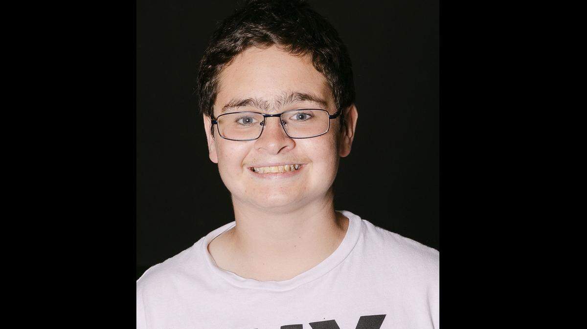 Zack, 15, likes to stay active by playing football, soccer and basketball.