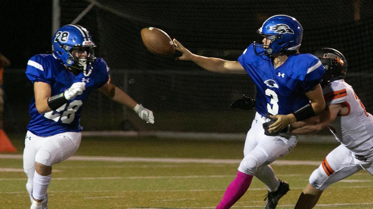 Olathe Northwest quarterback Zayne Wilson, #3, passed the ball to Manny Melendez, # 28 during the game against Shawnee Mission Northwest Friday, October 8, 2021. Shawnee Mission Northwest led 14-0 at the half.