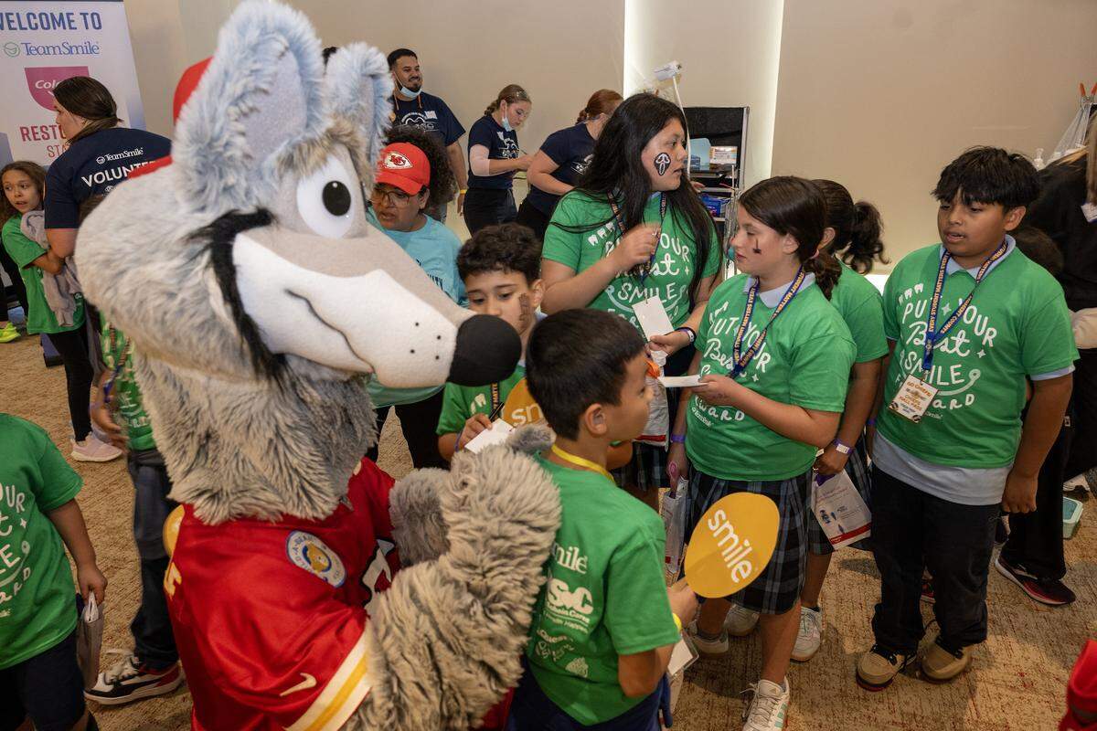 K. C. Wolf signed autographs for school children as the Kansas City Chiefs and TeamSmile provided free dental care to 300 school children from Kansas City and Kansas City, Kansas, during a dental tailgate on Tuesday, Sept. 9, 2025 at GEHA Field at Arrowhead Stadium.