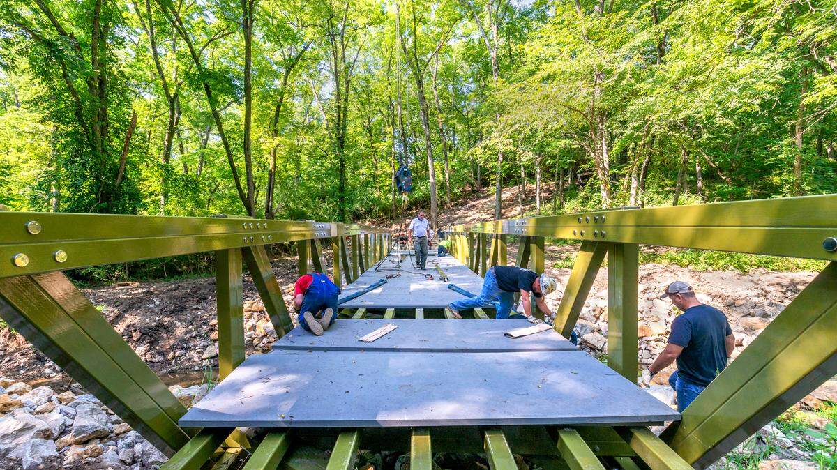 Midwest Crane & Rigging installed a new pedestrian bridge over Little Cedar Creek in Ernie Miller Park and Nature Center earlier this month.