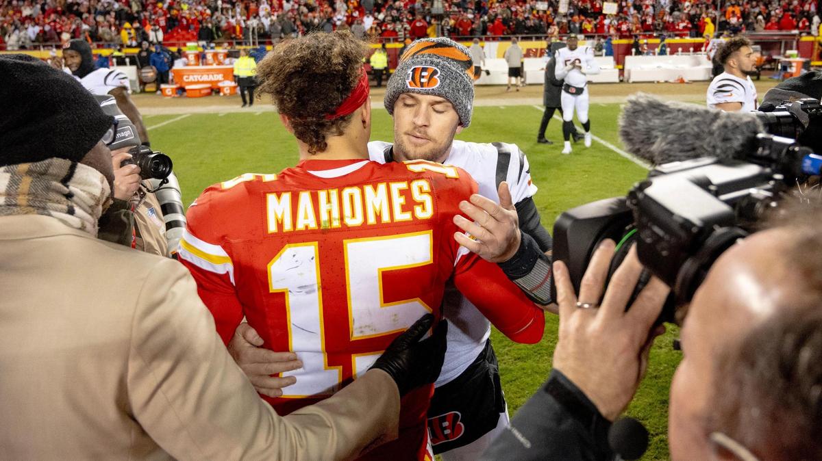 Kansas City Chiefs quarterback Patrick Mahomes (15) meets with Cincinnati Bengals quarterback Jake Browning (6) after the Chiefs defeated the Bengals 25-17 in an NFL football game at GEHA Field at Arrowhead Stadium on Sunday, Dec. 31, 2023, in Kansas City.