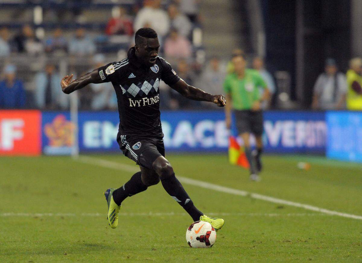 Sporting KC forward C.J. Sapong (17) passes the ball the ball during the second half of a match against Real Esteli FC at Sporting Park on Sept. 17, 2013.