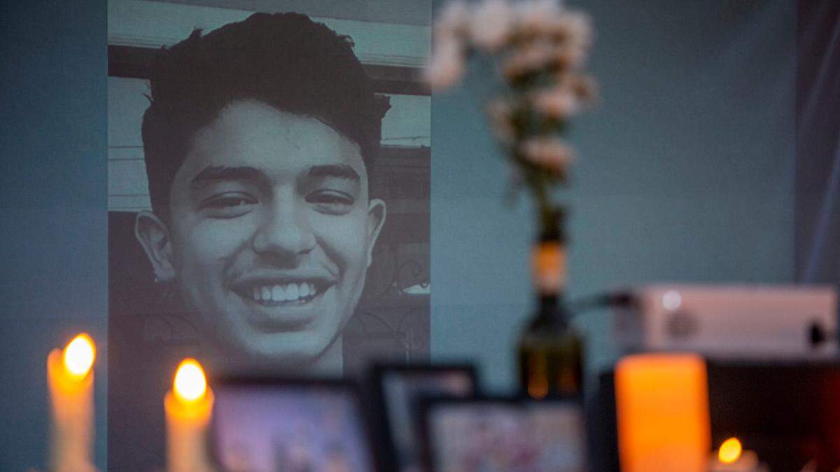 A slideshow was presented during a vigil for 14-year-old Rezwan Kohistani in Webb City, Missouri.