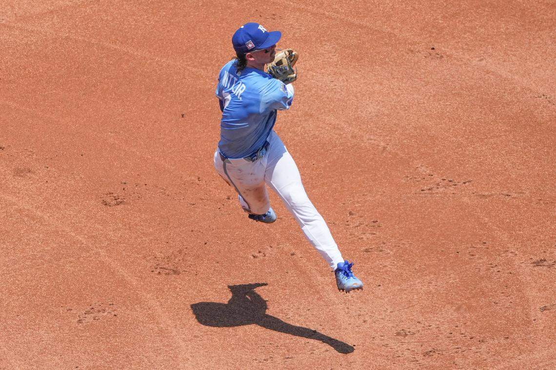 Jul 27, 2025; Kansas City, Missouri, USA; Kansas City Royals shortstop Bobby Witt Jr. (7) fields a ball and throws to first base against the Cleveland Guardians in the fourth inning at Kauffman Stadium. Mandatory Credit: Denny Medley-Imagn Images