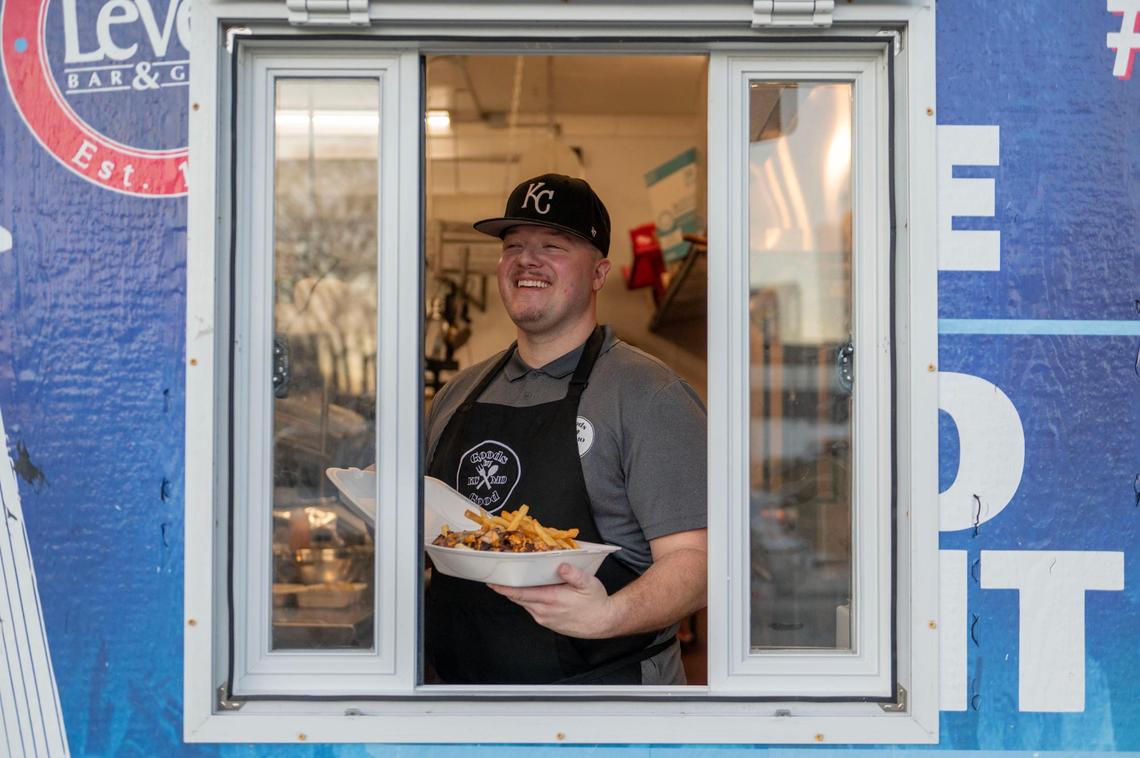 Owner of Goods by Good Jesse Goodeyon showcases a Goods Hefty Hawaiian Philly sandwich with house-seasoned fries.