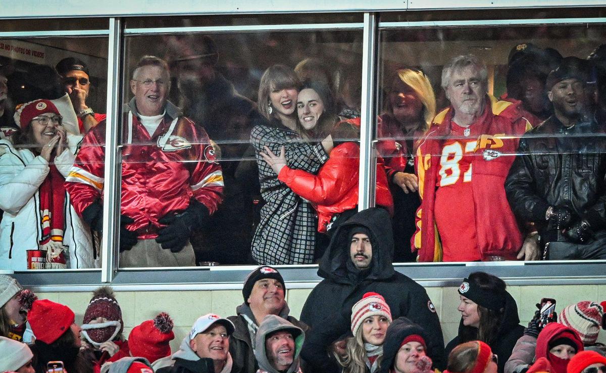 Taylor Swift and Caitlin Clark embrace after Kansas City Chiefs tight end Travis Kelce scored a touchdown in the fourth quarter against the Houston Texans during the AFC Divisional Round playoff game on Saturday, Jan. 18, 2025, at GEHA Field at Arrowhead Stadium.